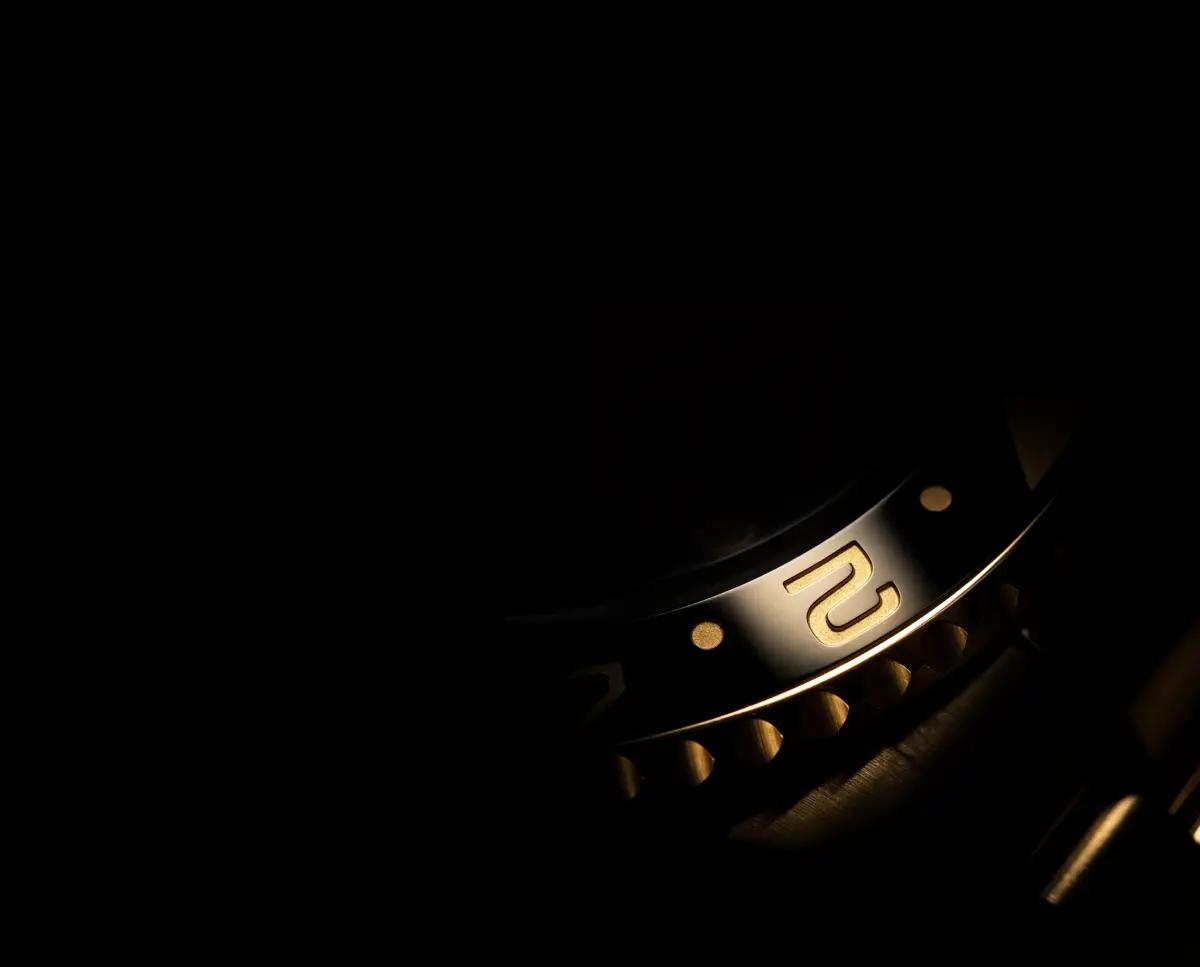 Close-up watch detail photography with dark moody lighting by Rahul Chanda, product photographer
