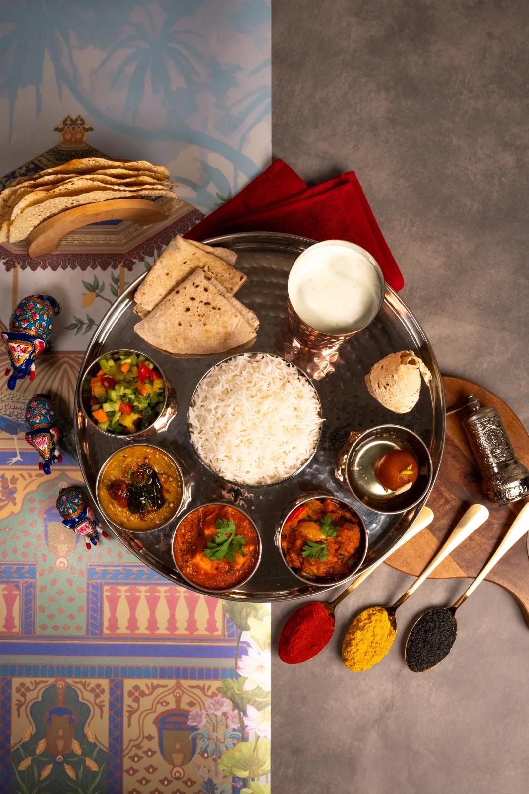 Editorial thali styling with naan and colourful backdrop, food photography by Rahul Chanda, commercial food photographer India